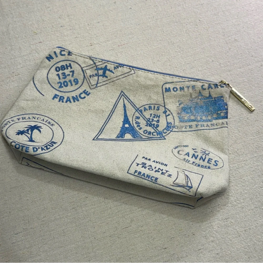 Lancôme Paris canvas cosmetic bag - blue passport stamp design